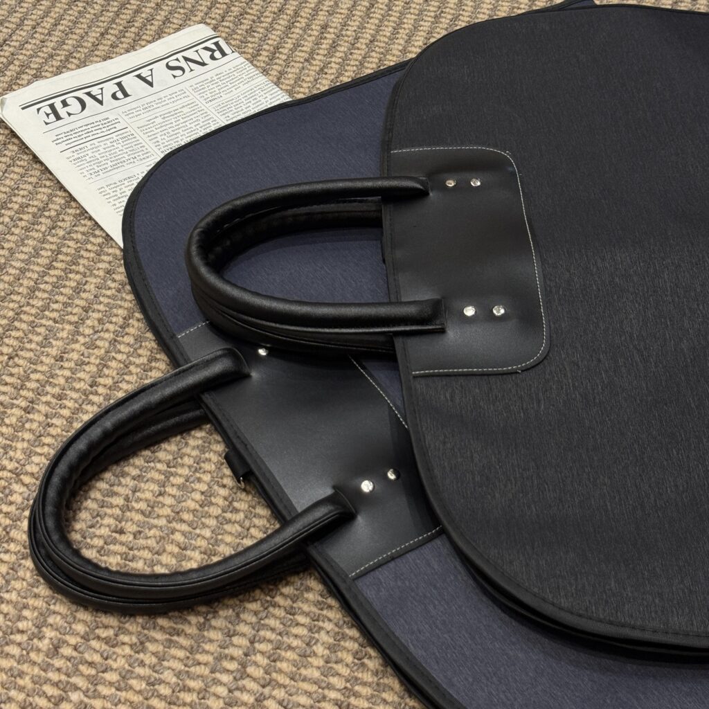 Suit bag with leather handle