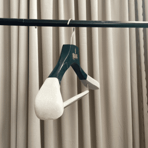 Green and cream velvet shoulder wooden suit hangers for boutique display