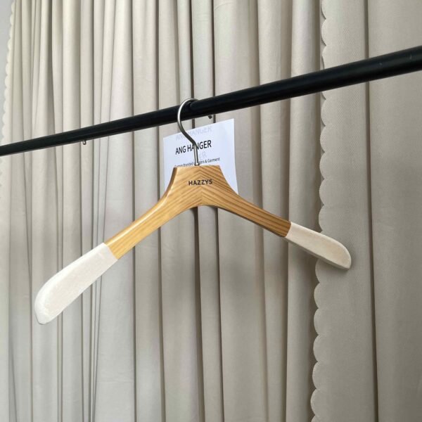 Light wood custom non-slip bridal hanger with velvet shoulder pads and engraved brand logo for wedding dress boutiques