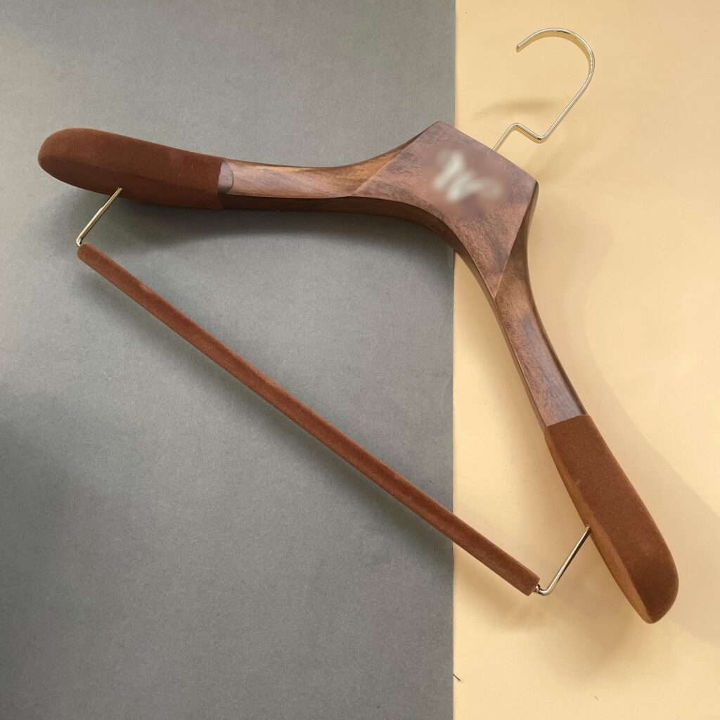 Custom heavy duty wooden coat hanger with thick solid wood body, velvet non-slip shoulders and velvet pant bar, premium gold hook suit hanger for luxury menswear brands