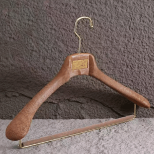 Walnut wood-grain custom plastic shirt hanger with gold hook and pants bar for clothing brands