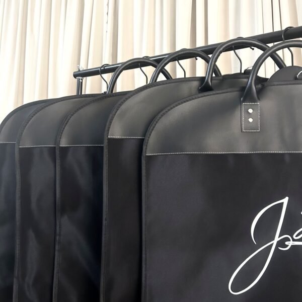 Premium leather garment bags with handles for easy travel and suit storage