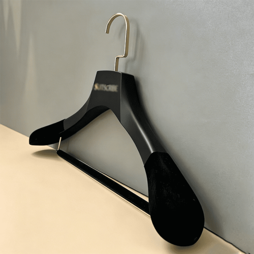Custom heavy duty wooden coat hanger with thick matte black solid wood body, velvet non-slip shoulders and gold metal hook, custom engraved logo premium suit hanger for luxury menswear brands
