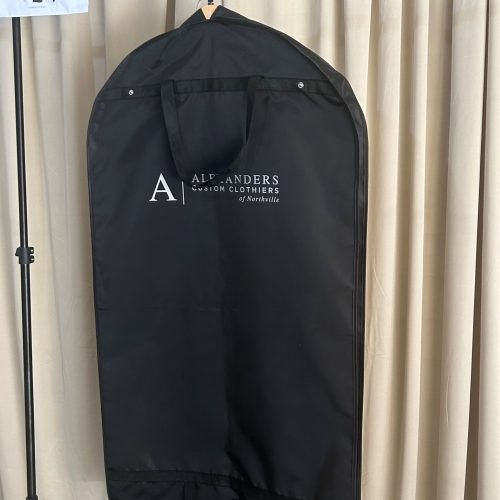 Black clothing garment bags wholesale with custom printed brand logo and reinforced carry handles, premium suit garment cover for apparel boutique inventory and retail packaging